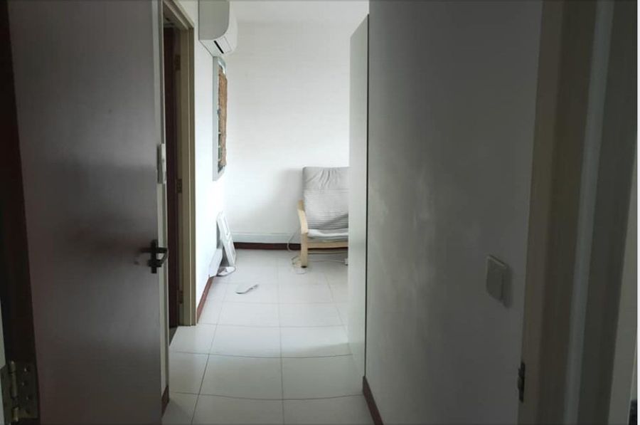 Hallway and bedroom of a rented apartment during inspection